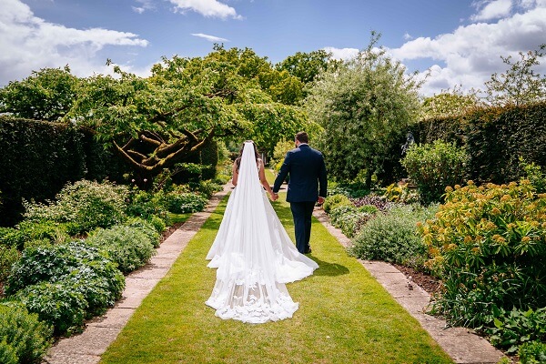 Micklefield Hall : Sarah Legge Photography : bride and groom herbaceous borders