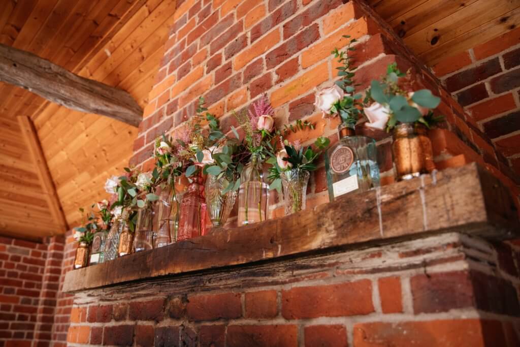 Micklefield Hall weddings, garden room fire place with flowers