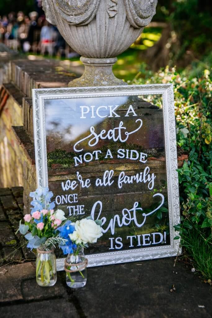 Pick a seat not a side were all family once the knot is tied sign