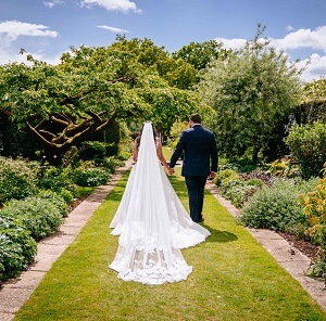 Micklefield Hall : Sarah Legge Photography : bride and groom herbaceous borders