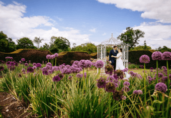 Micklefield Hall weddings, bride and groom in purple flowers