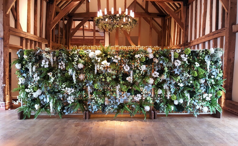 Micklefield Hall flower wall inside the great barn for weddings