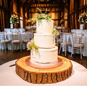 Micklefield Hall wedding, naked cake on wooden block in great barn