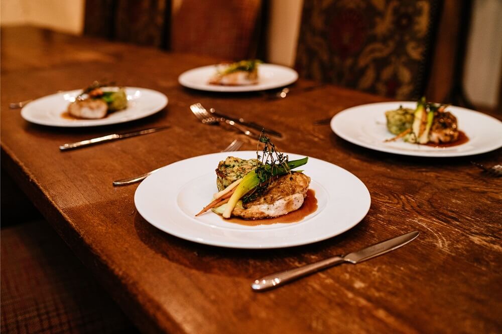 Micklefield Hall weddings, kalm kitchen chicken breast main course on white plates