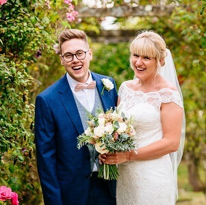 Micklefield Hall : Sarah Legge Photography : bride and groom rose garden