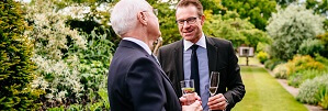 Micklefield Hall events, coporate guests drinking champagne in herbaceous borders