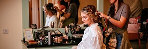 Micklefield Hall wedding, bride getting her hair done in bridal suite