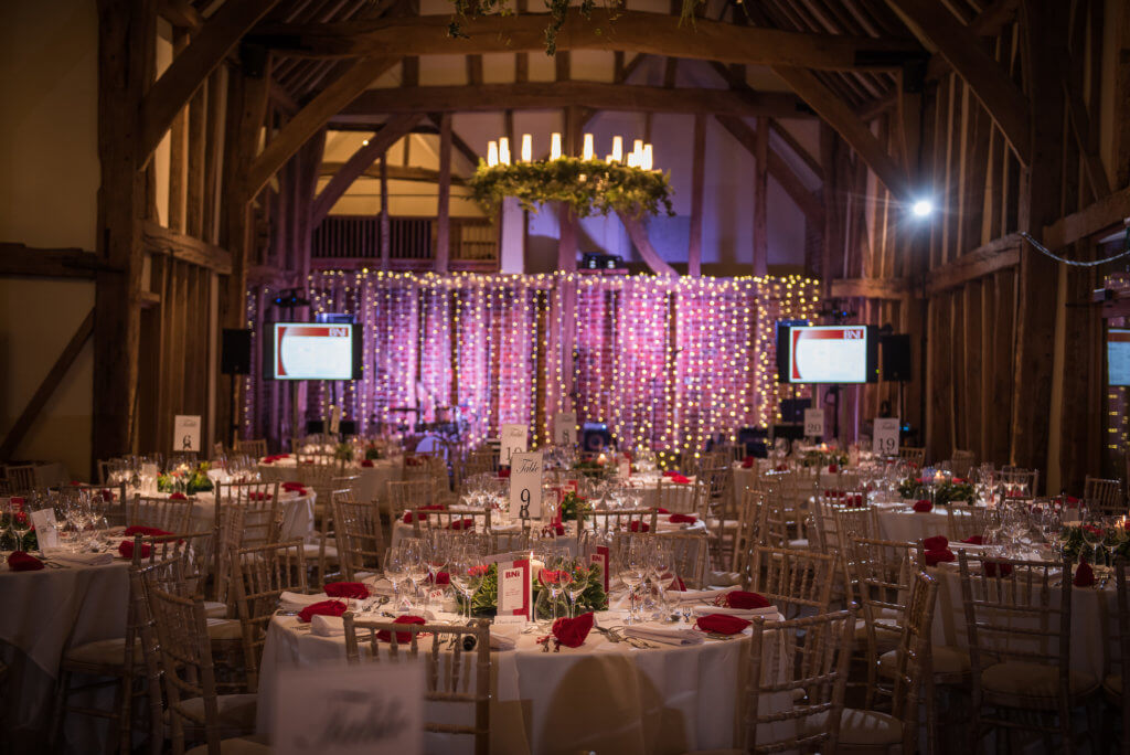 Decorated tables in the great barn at micklefield hall 