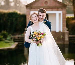 The newly married couple enjoying some couple pictures during their february wedding at micklefield hall