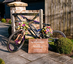 A bike being used as a welcome sign for the wedding of eleanor and mike